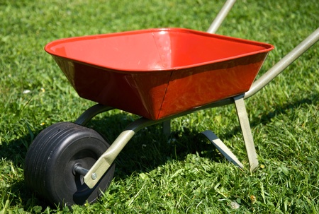 The red handbarrow in the garden.の写真素材