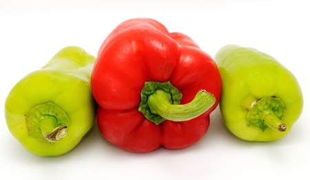 Red and green pepper placed on the white background の写真素材