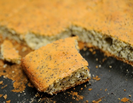 Cut piece of poppy cake on the pan の写真素材