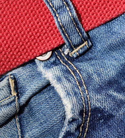 Macro shoot of jeans pocket and red belt の写真素材