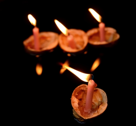 Christmas traditions decoration of nutshells with candles in water 