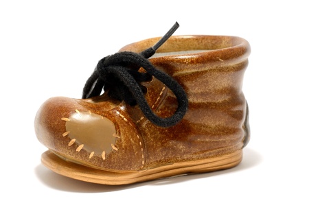 Ceramic decorative small shoe on a white background の写真素材