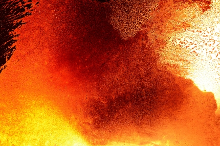 Grunge black orange background made from fire and dirty fireplace window の写真素材