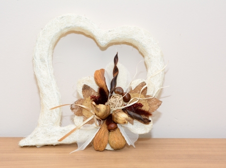Closeup shot with autumn decoration on the table  Heart with nuts の写真素材