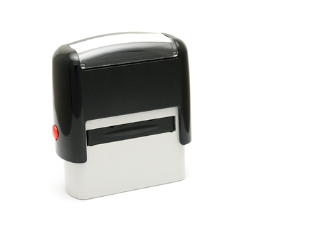 Mechanical office rubber stamp on a white background.の写真素材