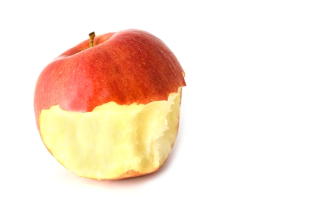 Bitten red apple on a white background.の写真素材