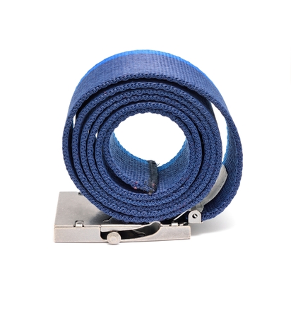 Blue rolled belt placed on a white background. Belt is made from polyester and it has metal buckle and two shades of blue color.の写真素材
