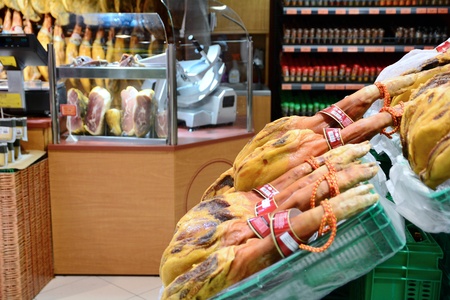 Interior of the butcher shop with whole parma ham legs.の写真素材