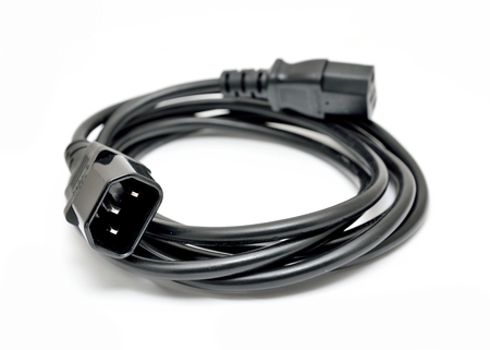 Black power cord with detail on the C14 (IEC320) connector on a white background.の写真素材