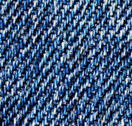 Blue jeans macro. Jeans fabric texture. Seam on jeans.の写真素材