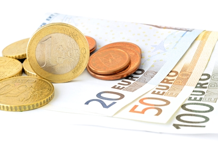 European Union banknotes and coins on white background. Euro currency. Euro coins. Euro banknote. 100 Euro. 50 Euro. 20 Euro. Euro bills. EU Billsの写真素材