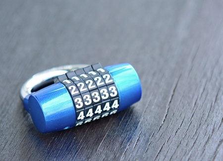 New blue metal combination lock on dark background. Combination lock. Lock. Blue lock. Code lock....