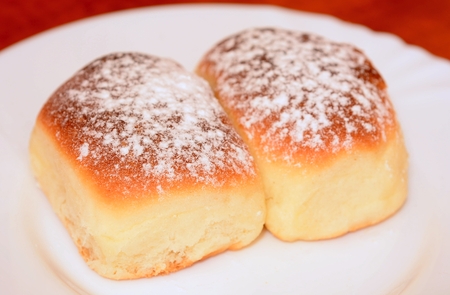 Sweet baked homemade buns powdered with sugar.の写真素材