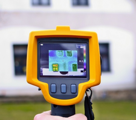 Recording Heat Loss of the House with Infrared Thermal Camera in Hand. の写真素材