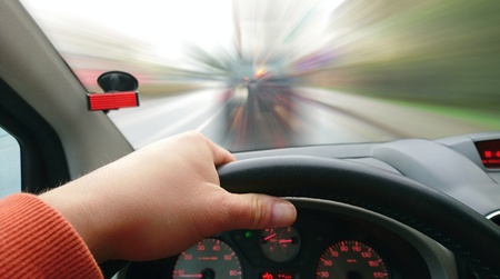 First Person View of Driver Behind the Wheel During Driving a Car. Point of View Shot of Driving a...