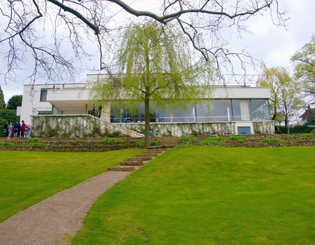 BRNO, CZECH REPUBLIC - APRIL 13, 2018: Garden view of the Villa Tugendhat with visitors on the terrace. The Villa of Greta and Fritz Tugendhat was designed by Ludwig Mies van der Rohe and was build in years 1929 and 1930.のeditorial素材