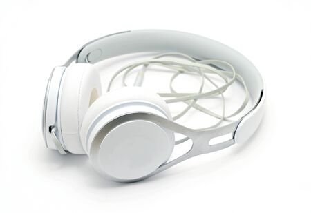 Close up of white headphones on white background.の写真素材
