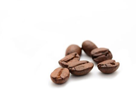Group of coffee beans on white background with copy space on left.の写真素材
