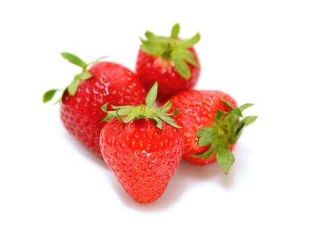 Group of fresh juicy strawberries over white background.の写真素材