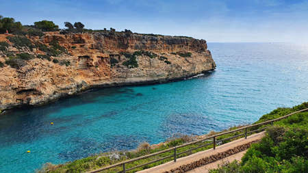 Sea view in Calas de Mallorca resort (or Cales de Mallorca) near Cala Antena beach hide at the rocky coast, Mallorca (Majorca), Spain.の写真素材