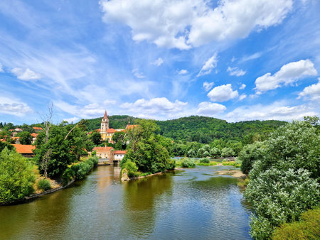 A view of Sazava Monastery and Sazava river under blue sky and white clouds in Sazava town in Central Bohemia, Czech Republic.の写真素材