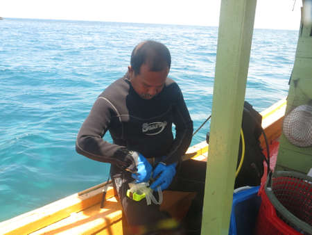 Malaysia, February 20 2020- A male prepare for diving activity in Redang islandのeditorial素材