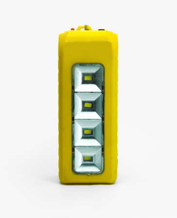 Old Yellow rough Electric chargeable search light Broken torch led flashlight isolated on white...