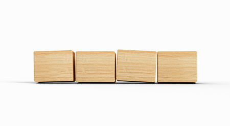 Four wooden toy cubes arranged in row on white backgroundの写真素材