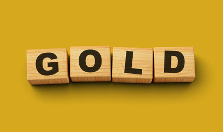 Wooden blocks Gold word concept isolated background 3d illustrationの写真素材