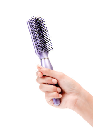 Female Hand Holding Shiny Purple Hair Brush Hair Accessories Closeup Photo On White Backgroundの写真素材