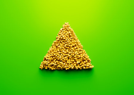 3d Unique Triangle Symbol Made Of Yellow Plastic Polymers On Bright Green Background 3d Illustration