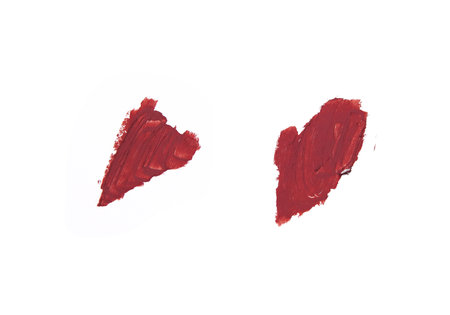 Closeup Of An Artistic Smear Of Creamy Red Lipstick With Smooth Texture Isolated On White Background