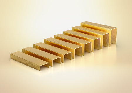 A Series Of Golden Metal Staple Pins Arranged In Parallel Rows On Yellow Background 3D Illustrationの写真素材