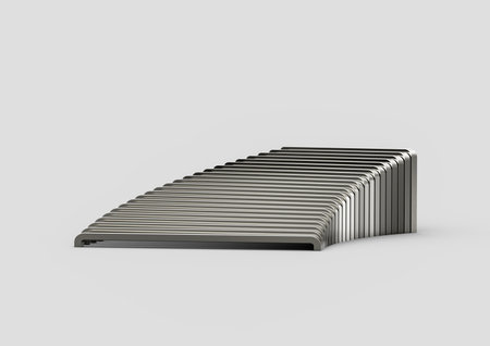 A curved arrangement of staple pins creates a sleek and abstract metallic pattern.