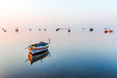 Fishing boats on the sea at sunrise, Goa, India