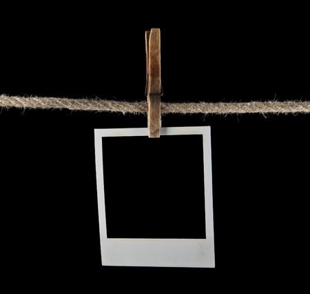 Empty instant photo on a black backgroundの写真素材