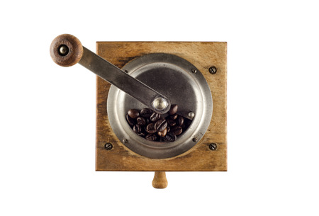 Photo of an antique coffee grinder isolated on a white backgroundの写真素材