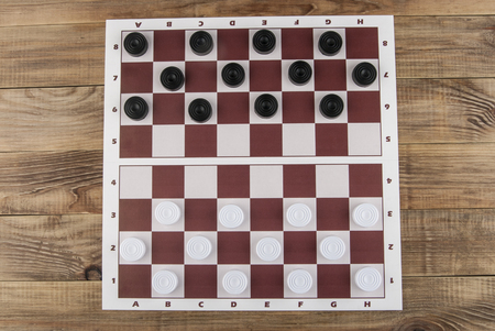 Checkers on a wooden table