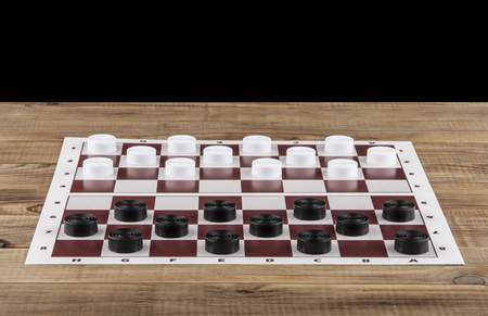 Checkers on a wooden table