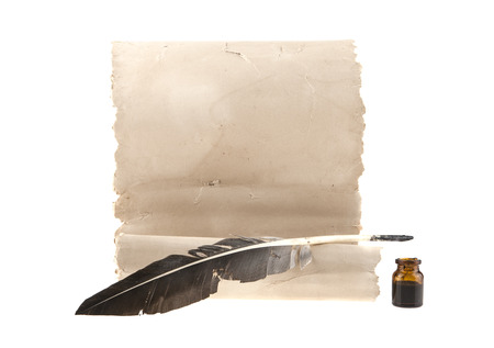Old paper and feather with ink isolated on a white backgroundの写真素材