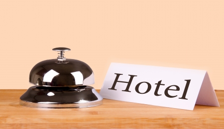 Hotel bell at the table. Isolated background.の写真素材