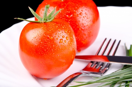 Tomatoes on a plateの写真素材