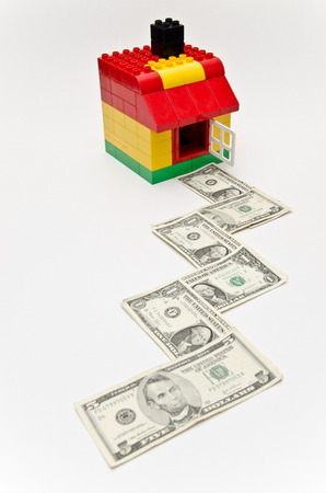 Toy house and money の写真素材