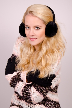 Winter girl with earmuffs in the studio の写真素材