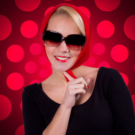 Pin-up girl over red polka-dot backgroundの写真素材