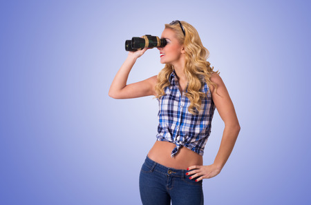 Caucasian Woman Looking Through Binocularの写真素材