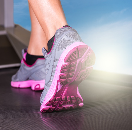 Runner feet running in fitness room closeup on shoe  Woman fitness の写真素材