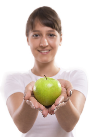 green apple in woman handsの写真素材