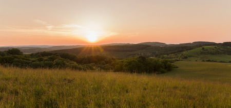 Late afternoon sun over the field.の写真素材