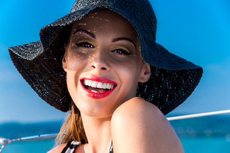 Caucasian woman smiling in hat at summer.の写真素材